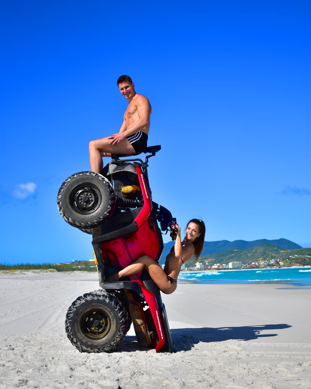 Couple on a quad bike on a beach in Brazil